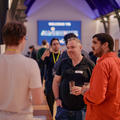 Attendees networking at a startup event