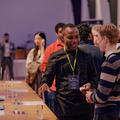 Attendees networking at a startup event