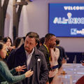 Attendees networking at a startup event