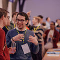 Attendees networking at a startup event