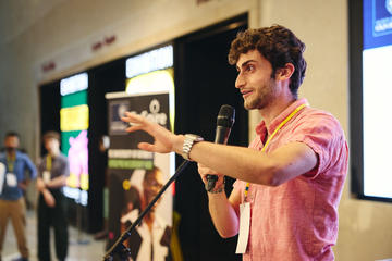 a man talking into a microphone