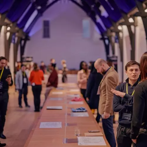 Attendees networking at a startup event