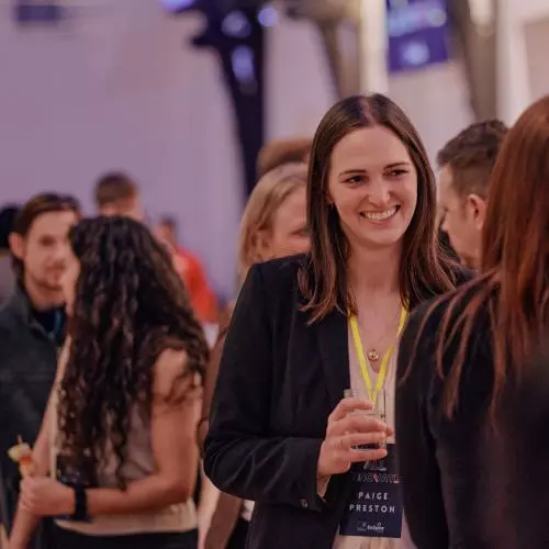 Attendees networking at a startup event