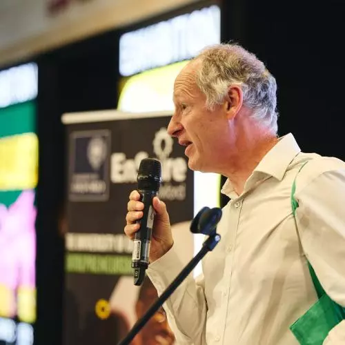 A man talking into a microphone