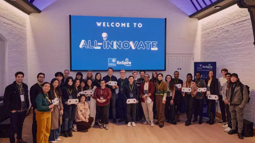 A group of early stage entrepreneurs smiling in a group at a startup event