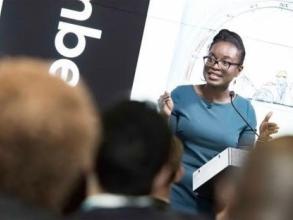 Doyin Atewologun presenting in front of a room