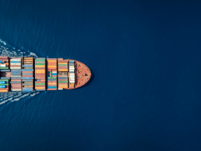 a dron picture of a half of a cargo shipon the left side