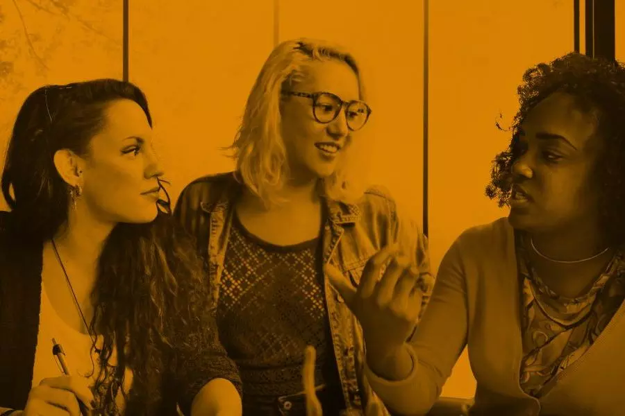 three woman talking together 